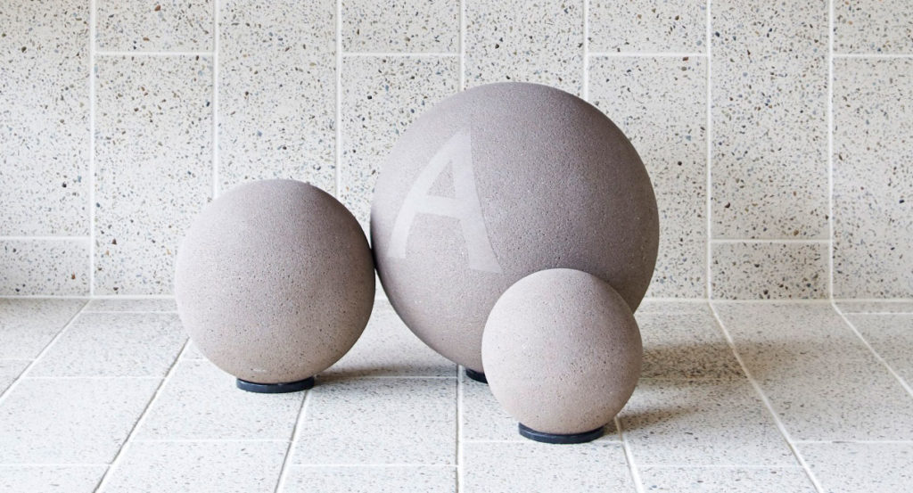 Anston spheres and Ironstone exposed aggregate paving in Ivory.